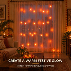 Orange LED curtain lights create a festive ambiance in a living room with traditional decor.
