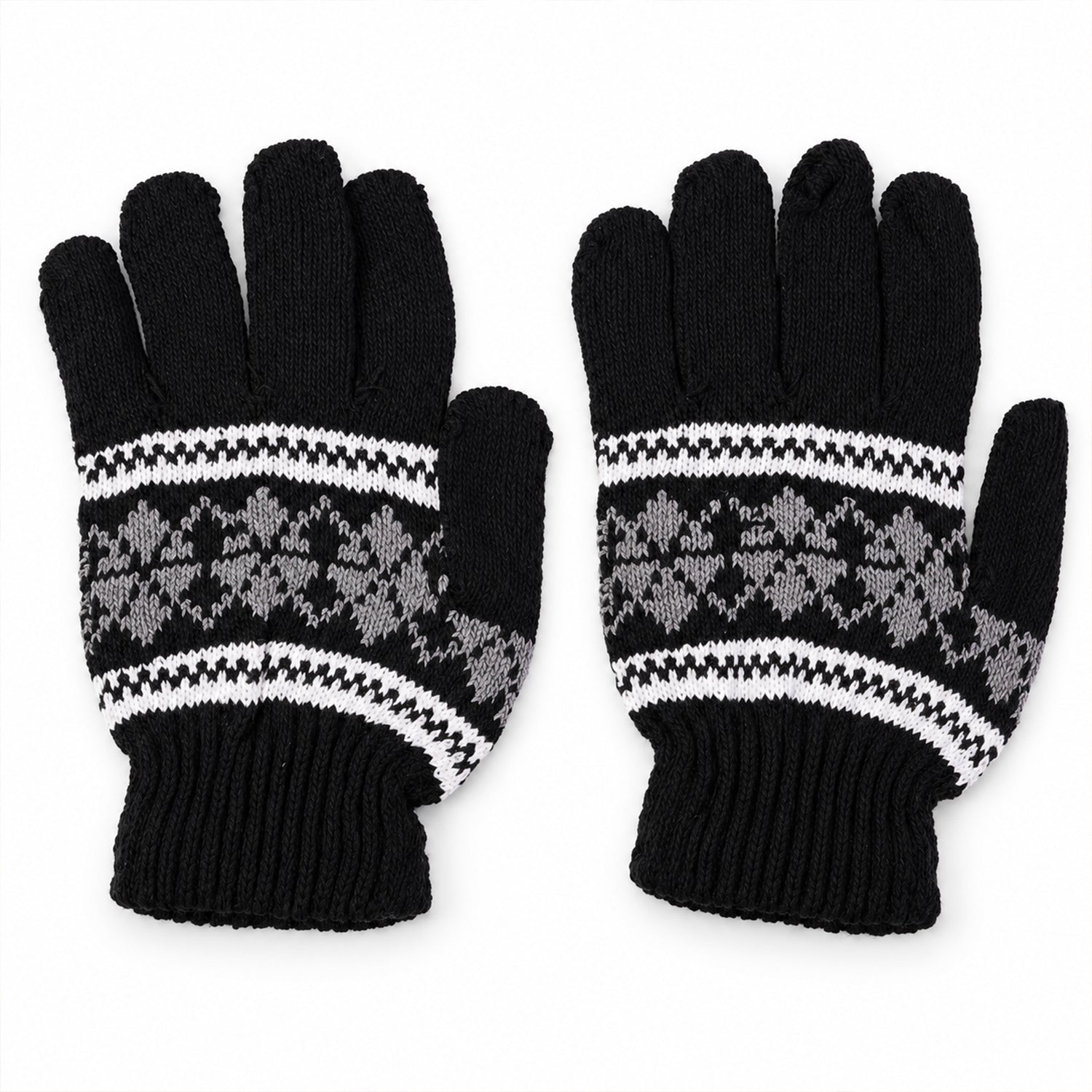 A pair of black knitted gloves with a white and gray snowflake pattern laid flat on a white surface.