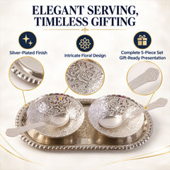 A silver-plated serving set with two bowls, two spoons, and an oval tray, highlighting intricate floral designs.
