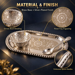 An ornate silver-plated serving set with a bowl, spoon, and tray, showcasing detailed floral engraving and embossed handles.