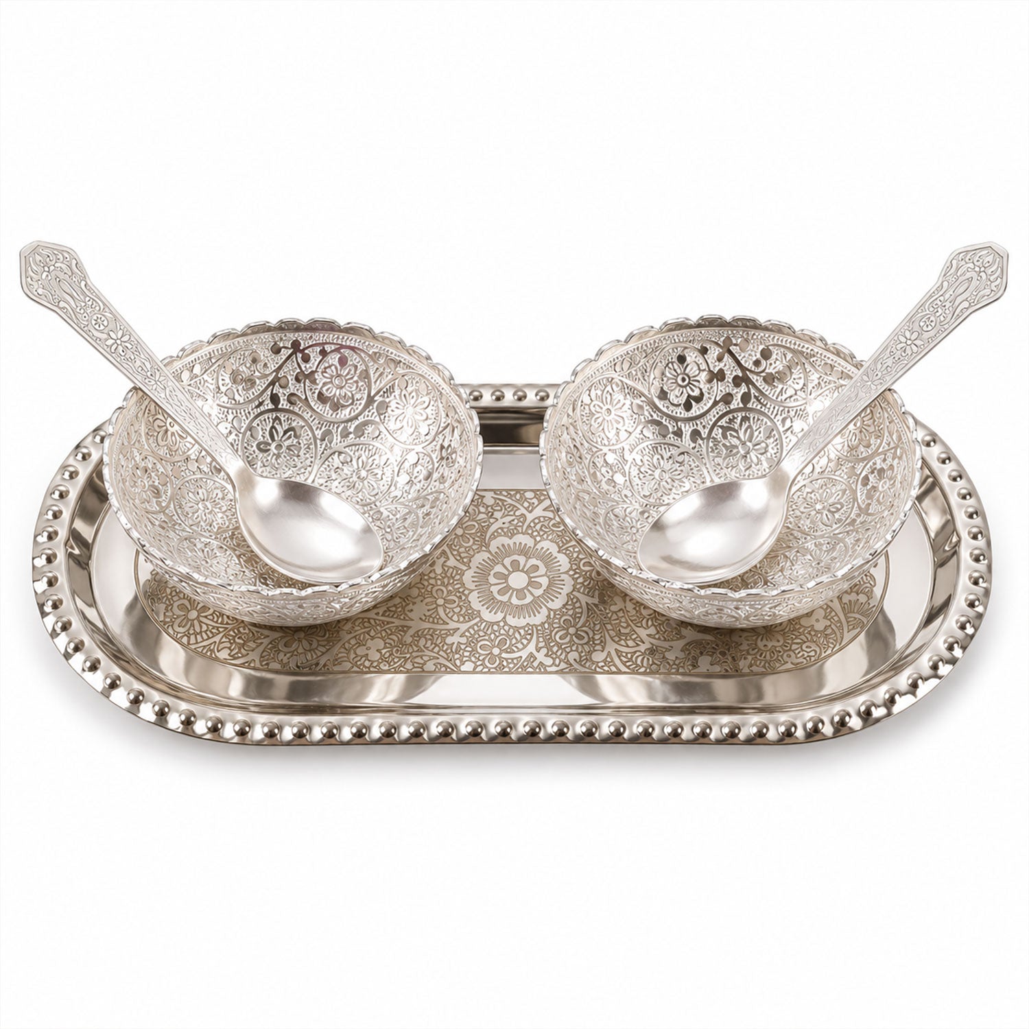 A silver-plated serving set with two decorative bowls and two spoons resting on an oval tray, against a white background.
