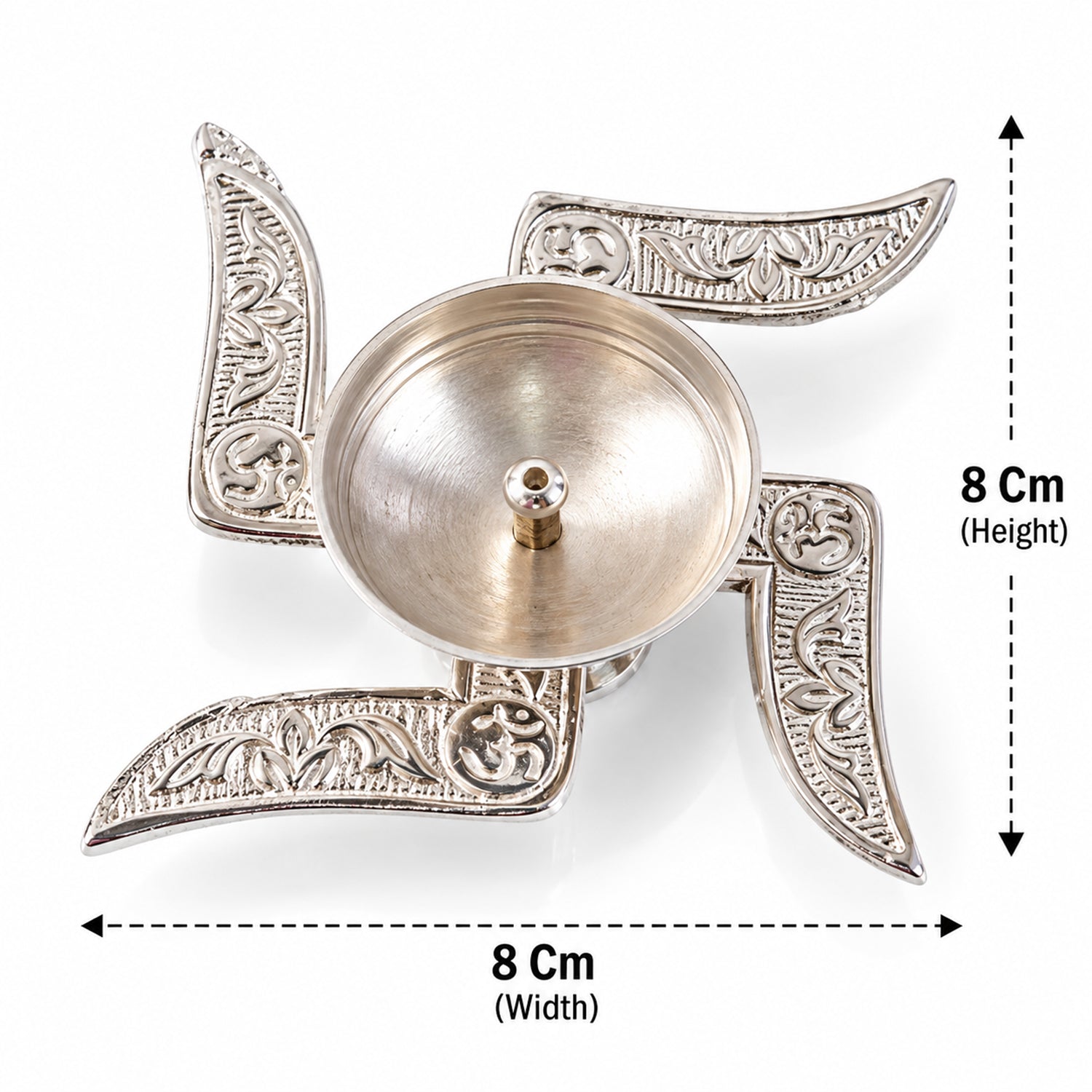 A silver swastik diya with a central oil cup is shown with its height and width dimensions labeled in centimeters.
