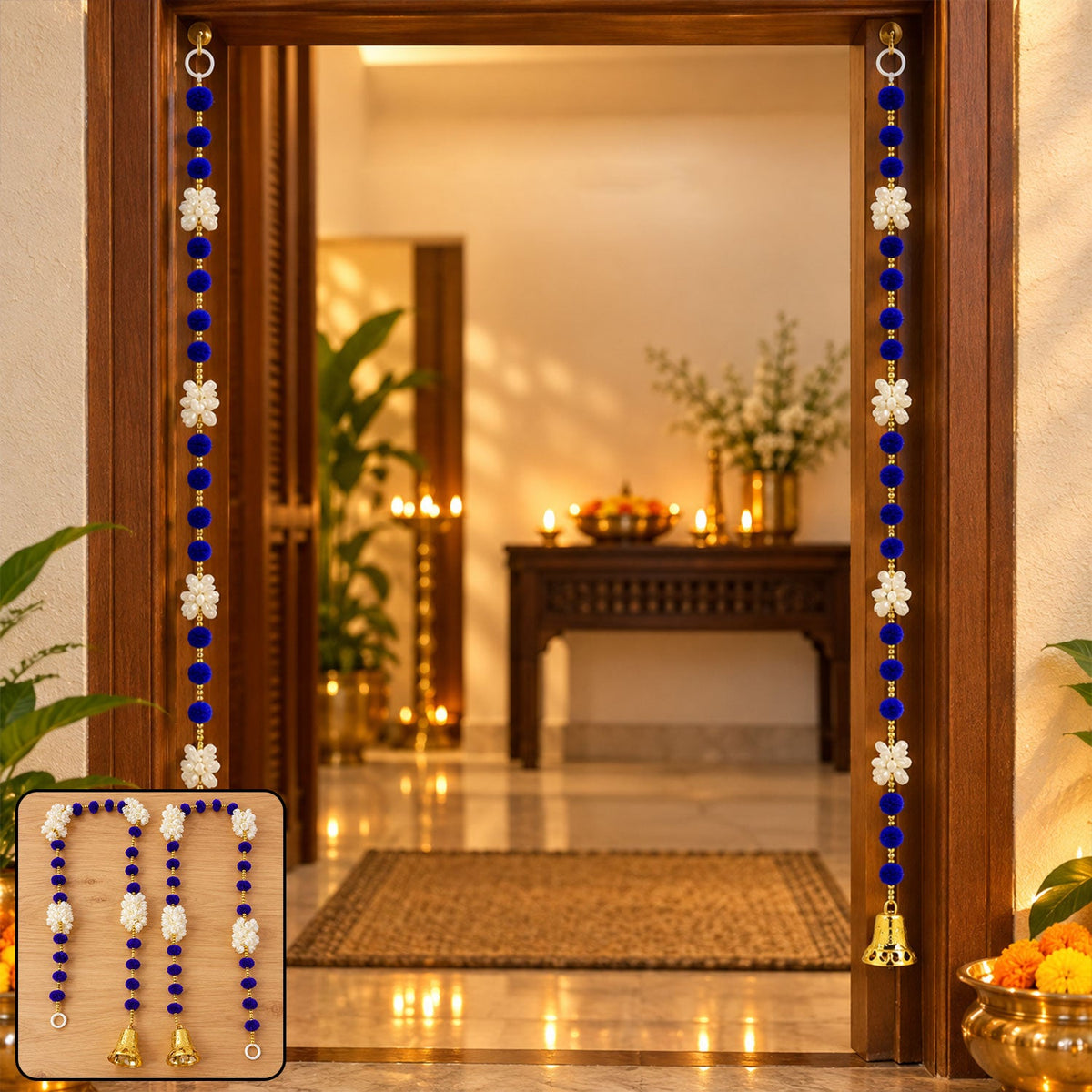 Two blue and white decorative hangings with golden bells adorn a wooden doorway, with a blurred interior setting behind.
