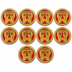 Ten golden Lakshmi Charan stickers with red backgrounds and braided gold borders arranged in rows on a white surface.