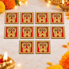 Ten golden Lakshmi Charan stickers are arranged on a light-colored surface, surrounded by vibrant marigold petals and soft