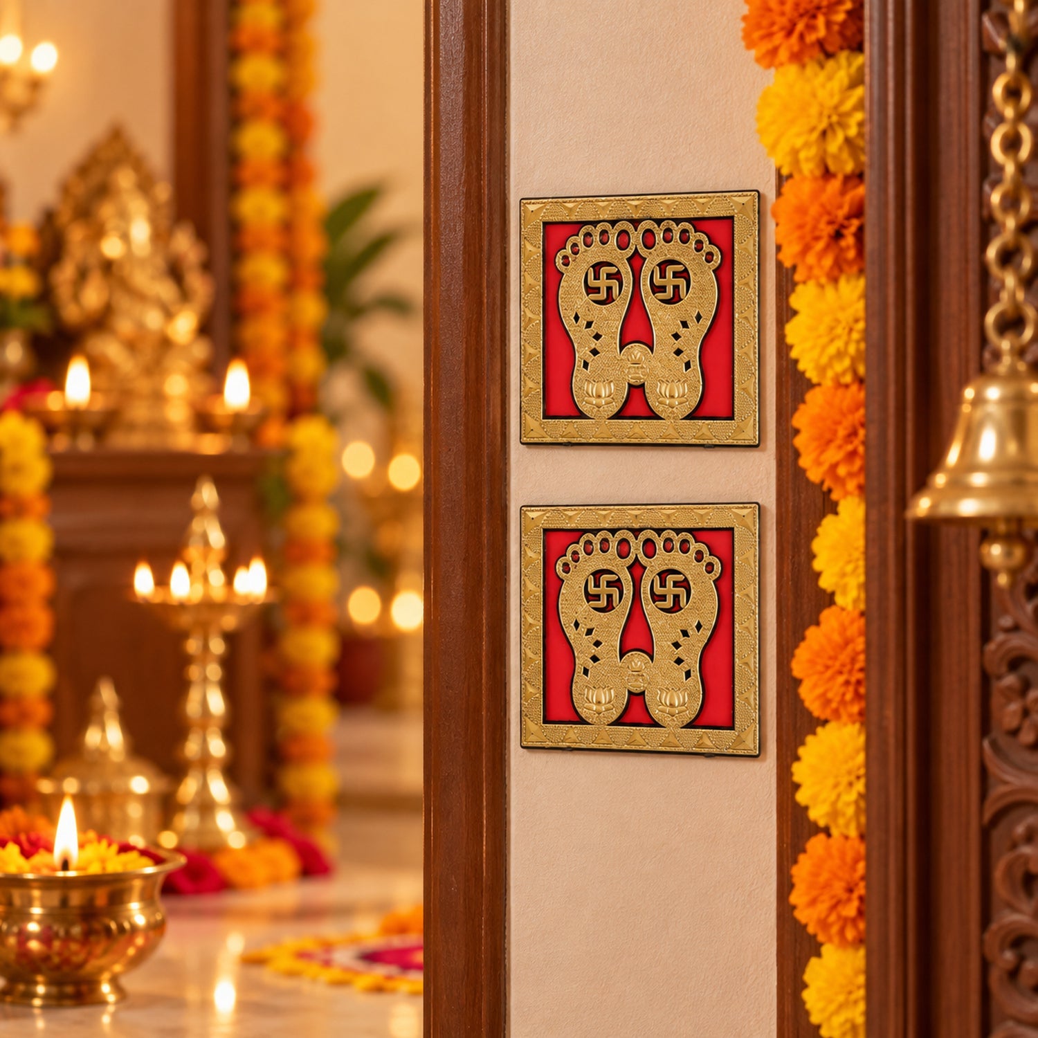 Two golden Lakshmi Charan stickers adorn a light brown door, with a blurred background of a festive interior and lit lamps.