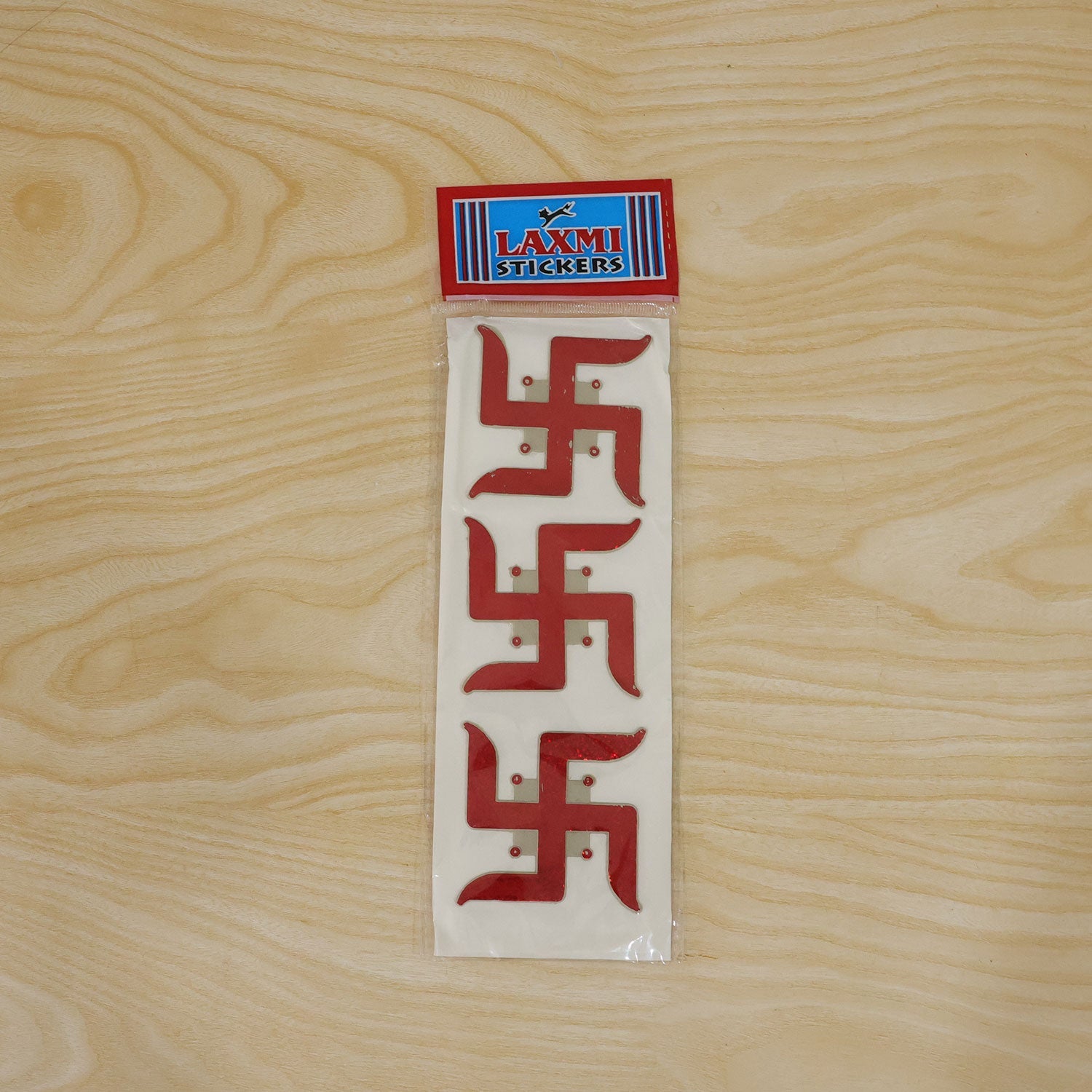Red glitter Swastik decor set on a display