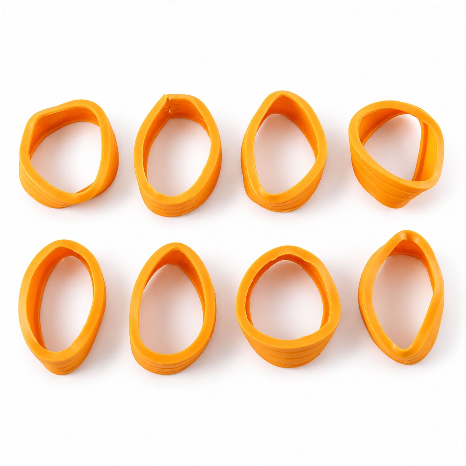 Eight individual orange silicone wheel covers are arranged neatly on a clean white surface.