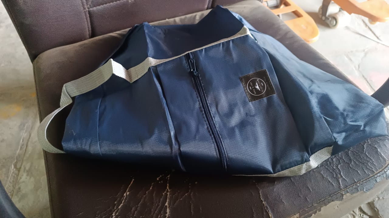 Packed foldable travel bag in use