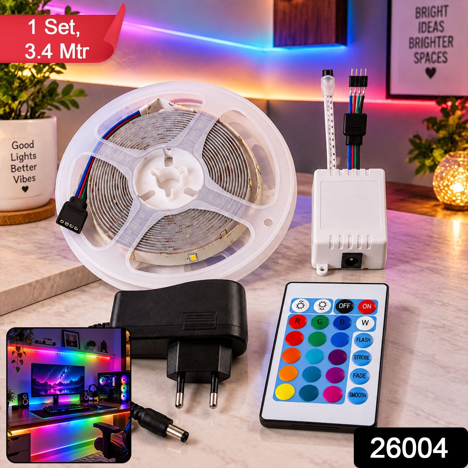 A coiled RGB LED strip light, white controller, power adapter, and remote control on a wooden surface, with a gaming setup