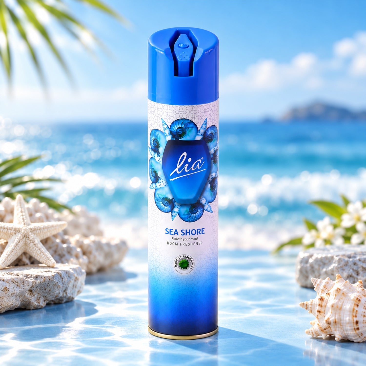 A blue and white aerosol spray can with a seashell design stands on a reflective surface by the ocean.