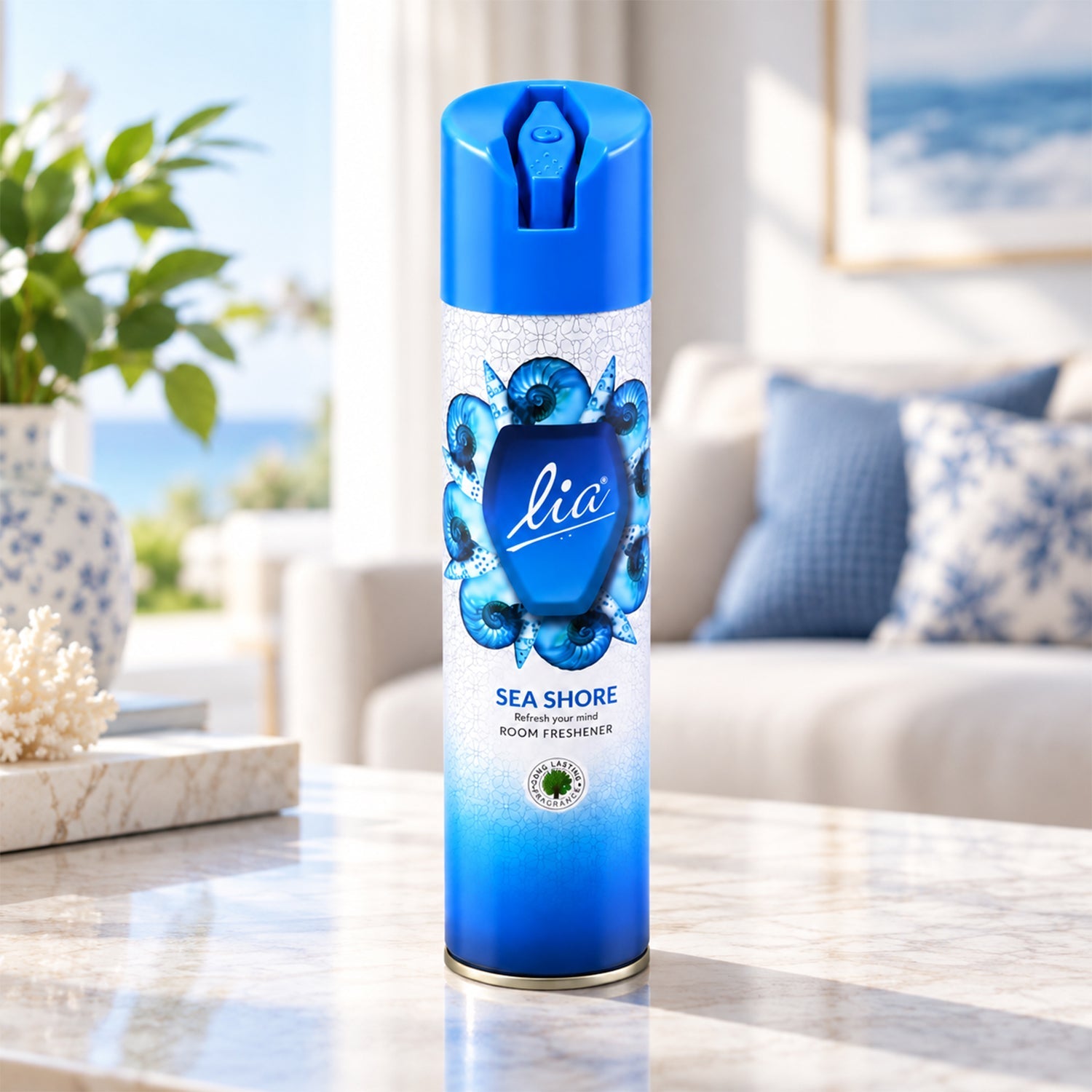 A blue and white aerosol spray can with a seashell design rests on a marble table in a living room.