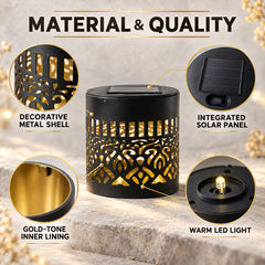 A black solar lamp with a cut-out mandala pattern, gold inner lining, and a solar panel on top.