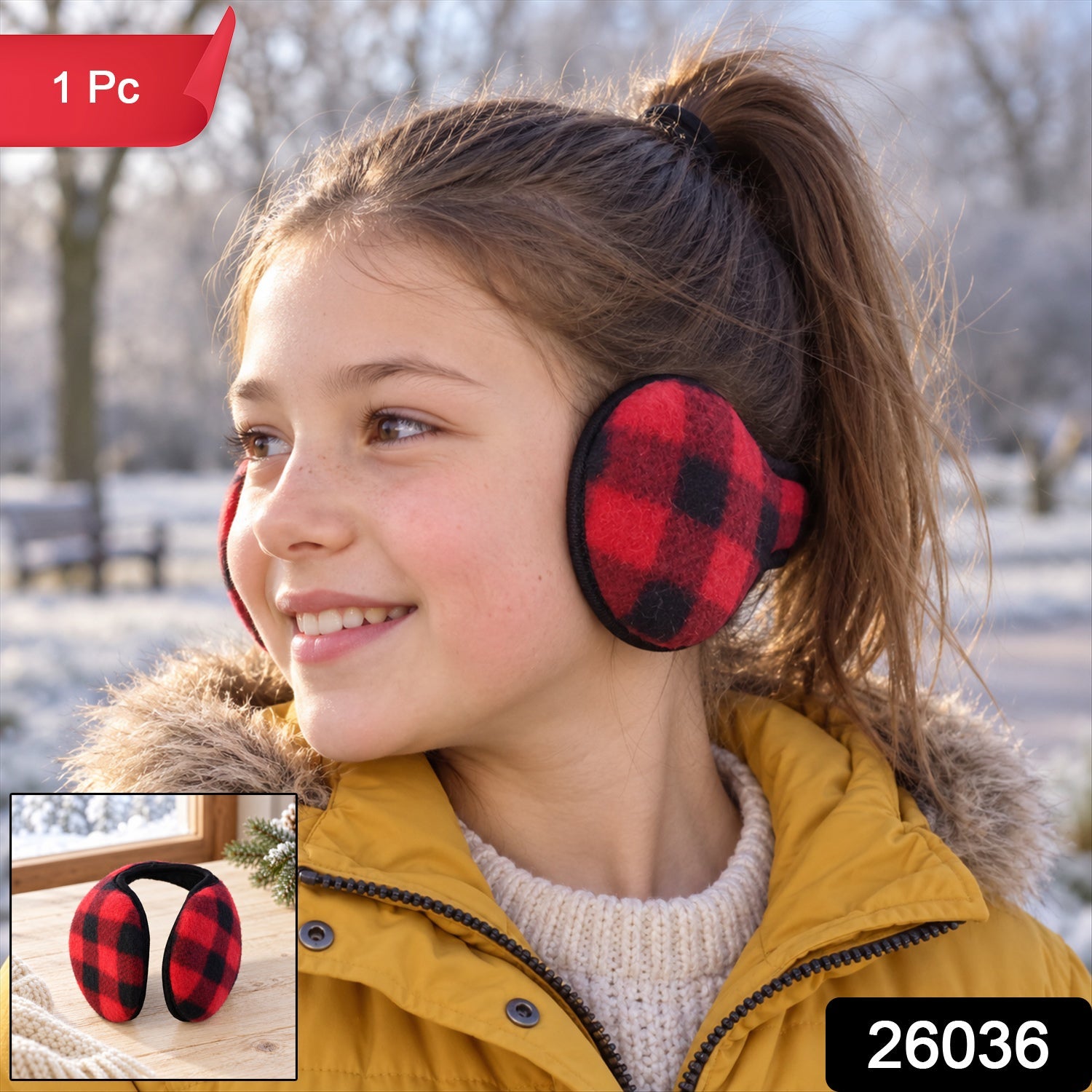 A smiling girl in a yellow coat wears red and black plaid ear warmers in a winter landscape.