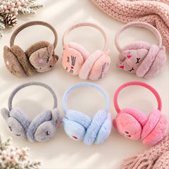 Six pairs of soft, colorful animal-themed earmuffs are displayed on a light surface beside a knitted pink scarf.