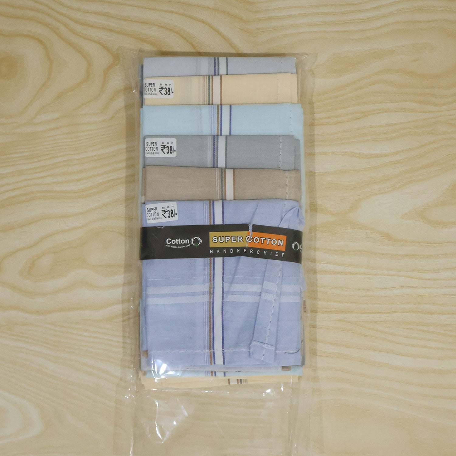 A clear plastic package containing six folded cotton handkerchiefs in assorted colors, with a brand label.