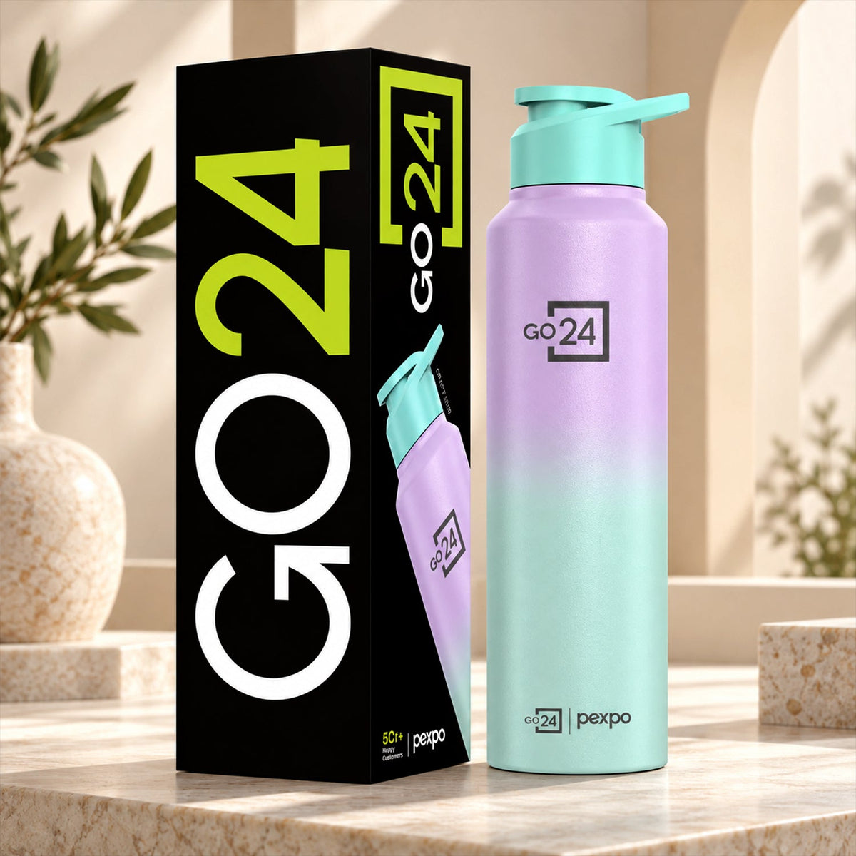 A tall, ombre purple and mint green water bottle with a mint green straw lid stands beside its black packaging box.