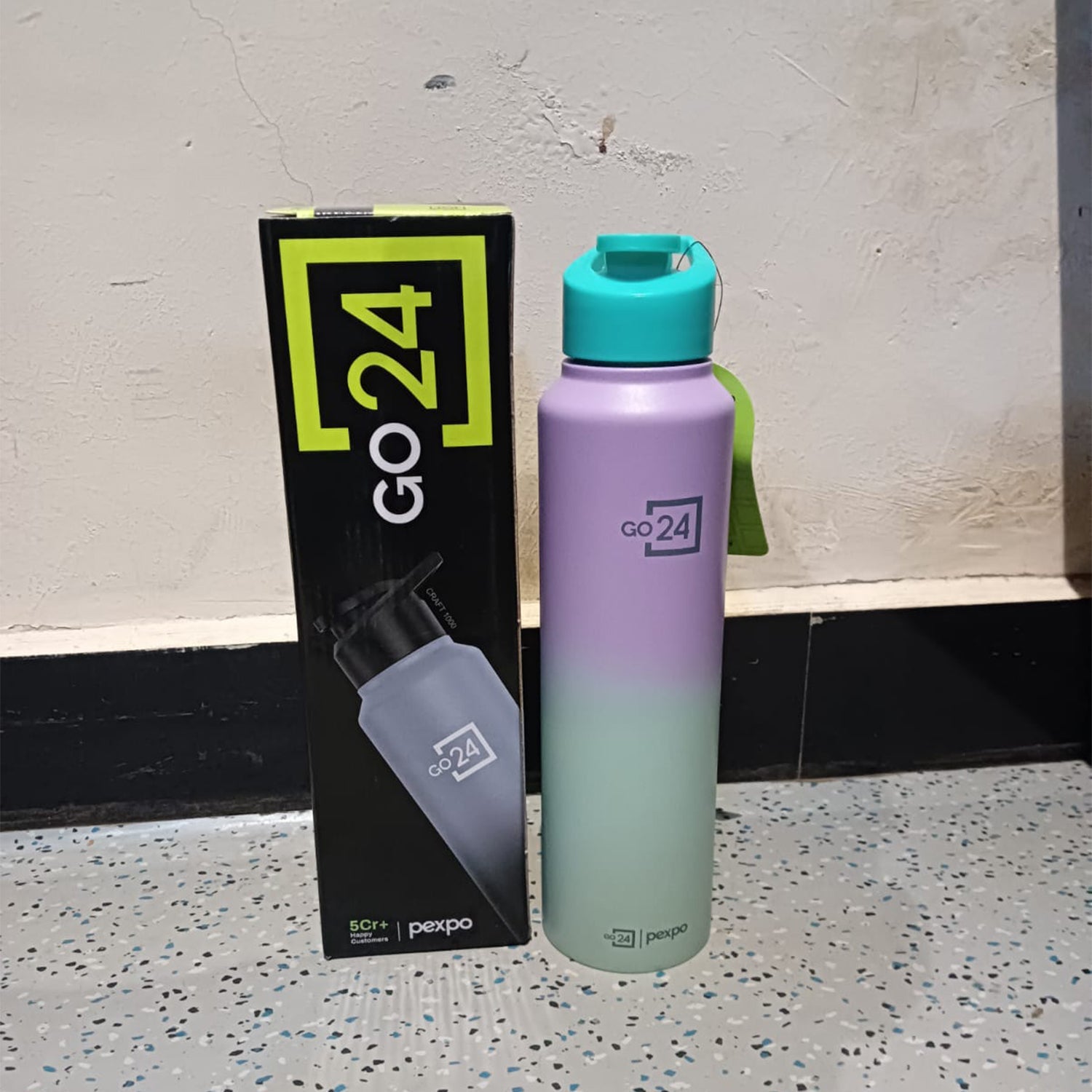 Ombre stainless steel water bottle in daily use scenario
