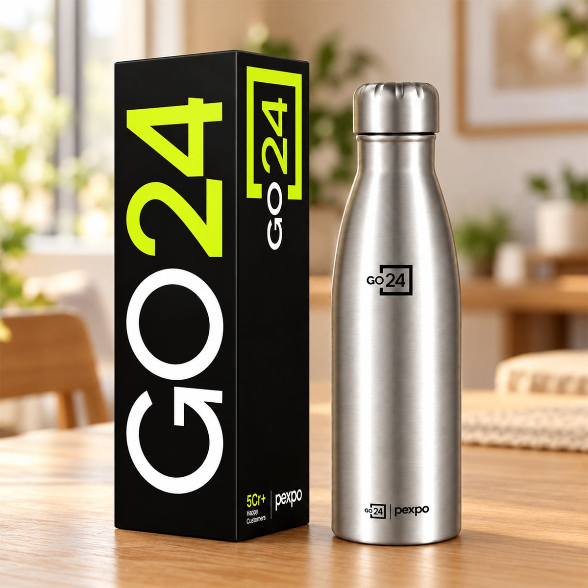 A silver stainless steel water bottle stands next to its black and neon green branded packaging box.