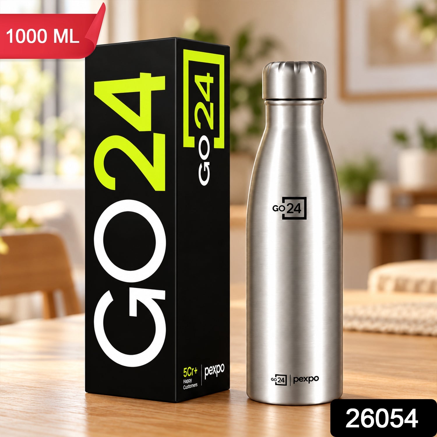 A silver stainless steel water bottle stands beside its black branded box on a wooden table.