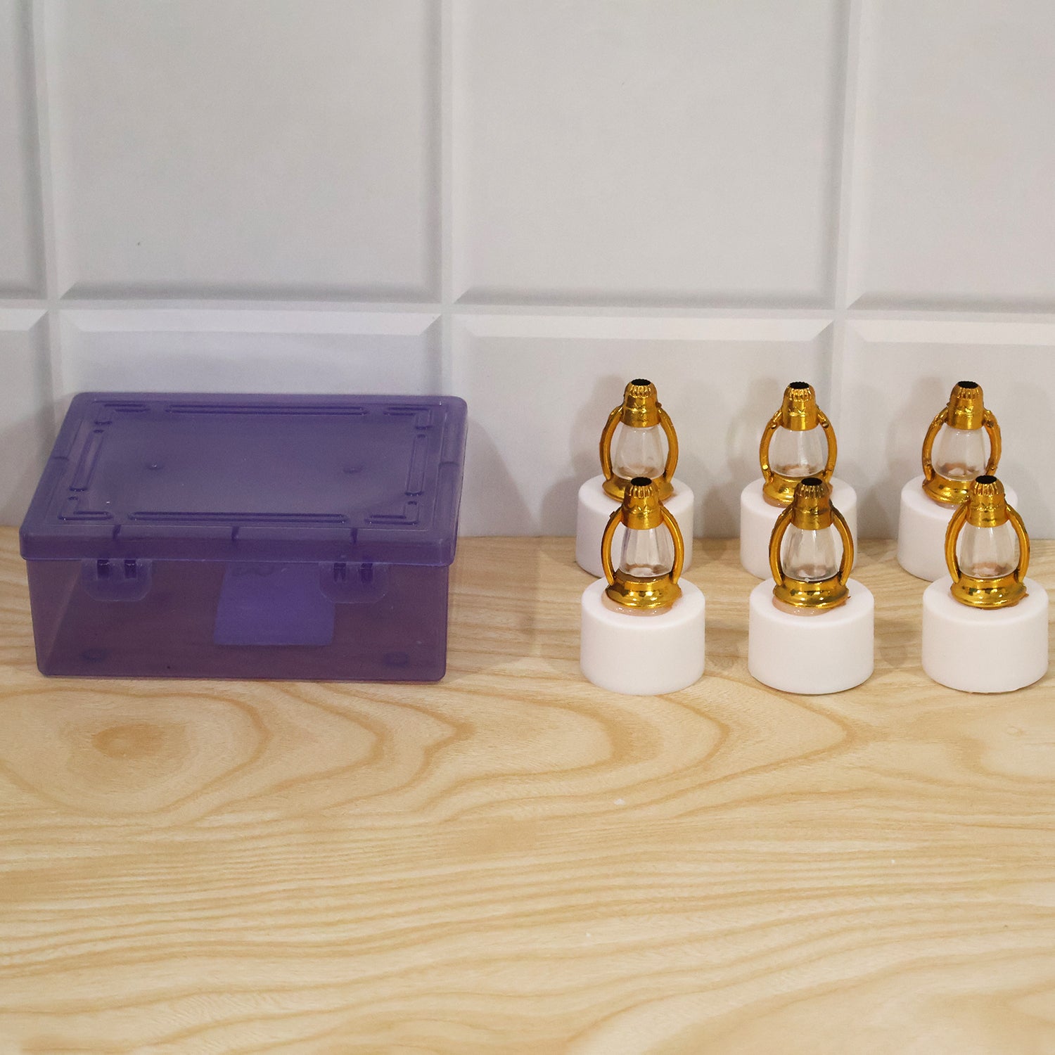Six miniature LED lantern decorative lights in their clear plastic packaging