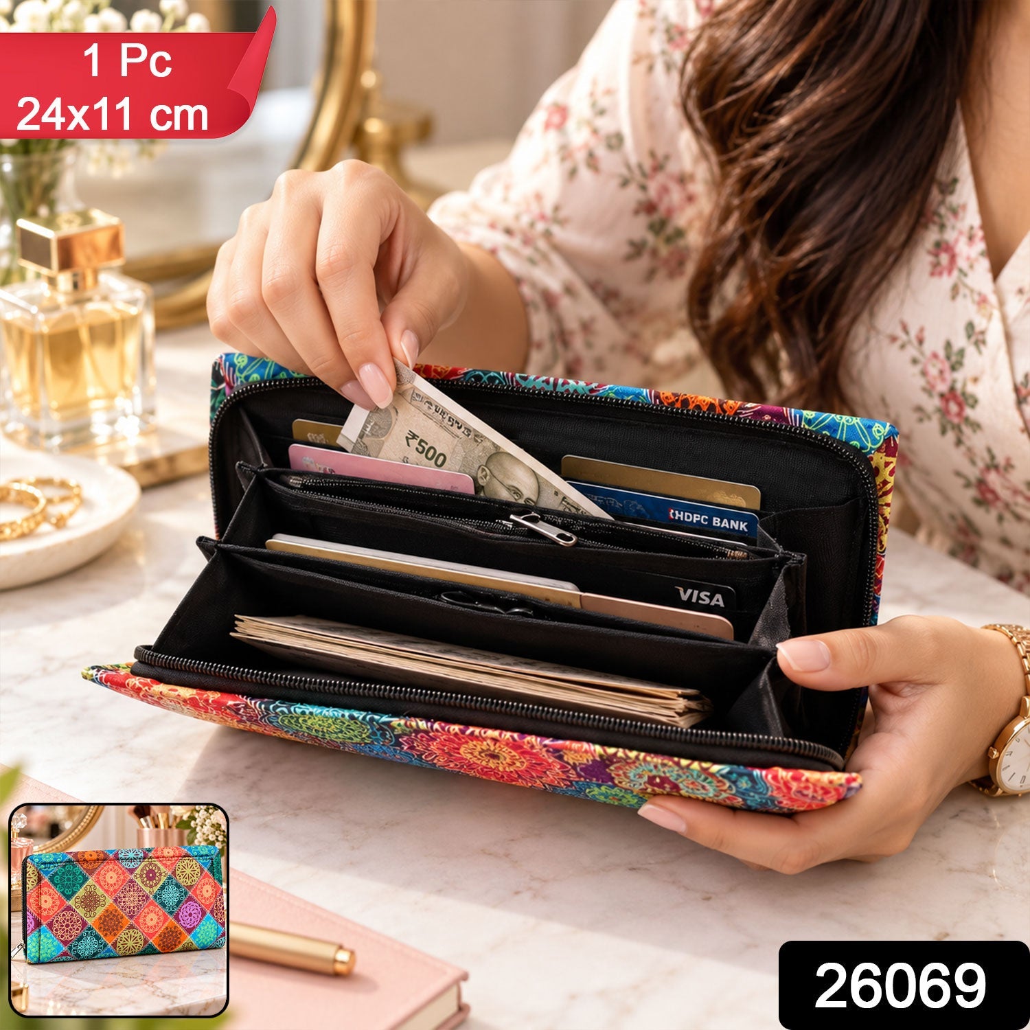 A person is shown putting a credit card into a colorful, patterned clutch wallet while sitting at a cafe table.