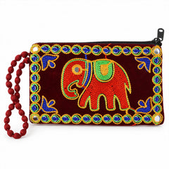 A dark red velvet clutch purse with a red elephant embroidery, blue and green beaded trim, and a red beaded wrist loop.