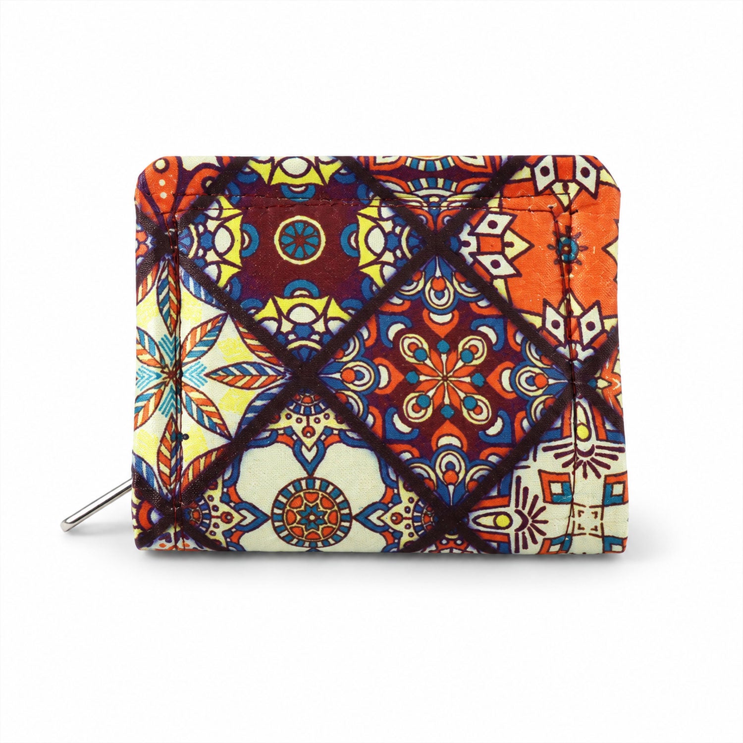 The compact fabric coin purse, featuring a vibrant mosaic pattern and a silver zipper, rests on a white surface.