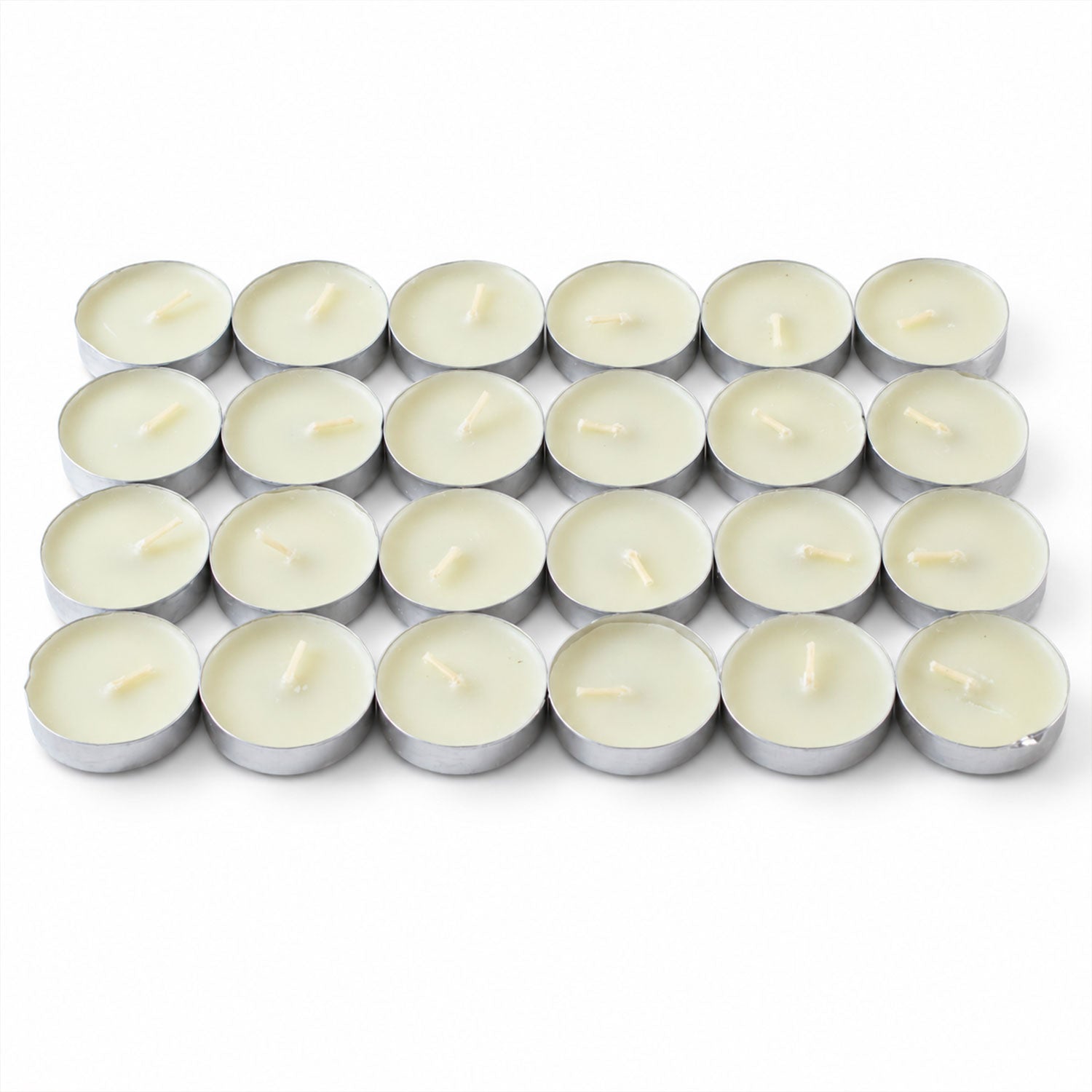 Twenty-four unlit white tealight candles with wicks, neatly arranged in a grid on a plain white surface.