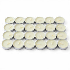 Twenty-four unlit white tealight candles with wicks, neatly arranged in a grid on a plain white surface.