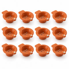 Water sensor flameless LED diyas in a festive arrangement on a table