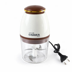 A white and brown electric food chopper with a clear bowl and visible steel blades, unplugged, on a plain white surface.