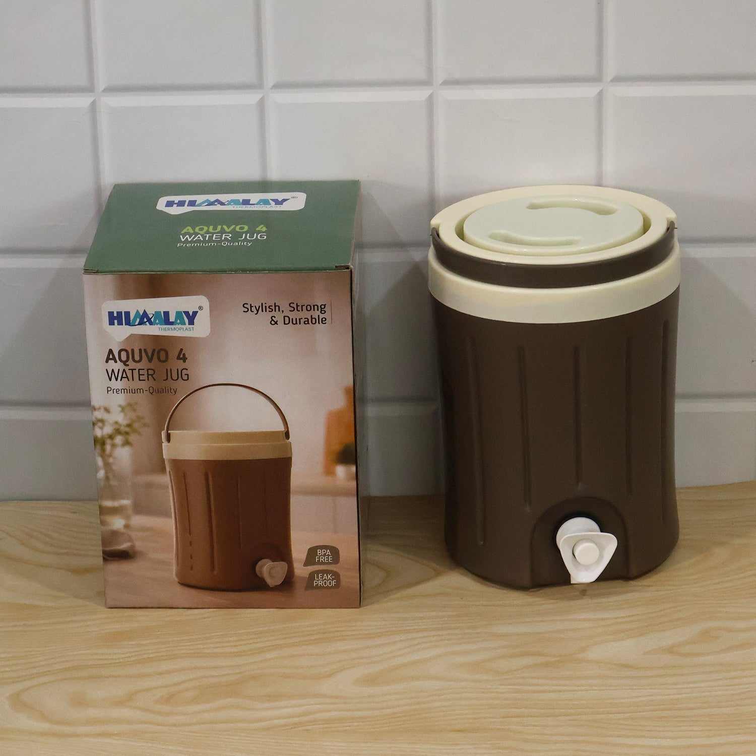 Insulated water jug with dispensing tap being used in a home environment