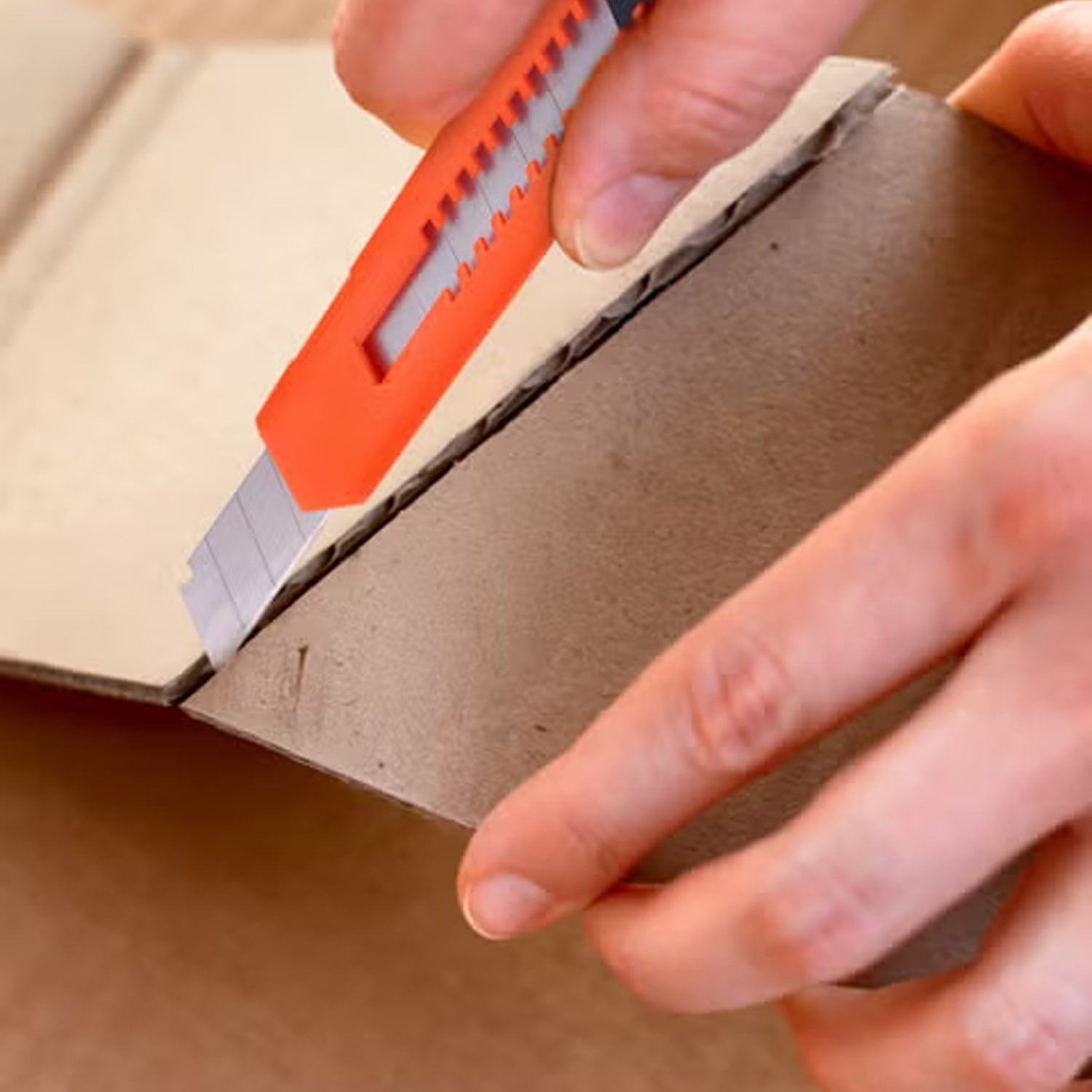Utility knife blades stored safely in transparent tubes for easy access.