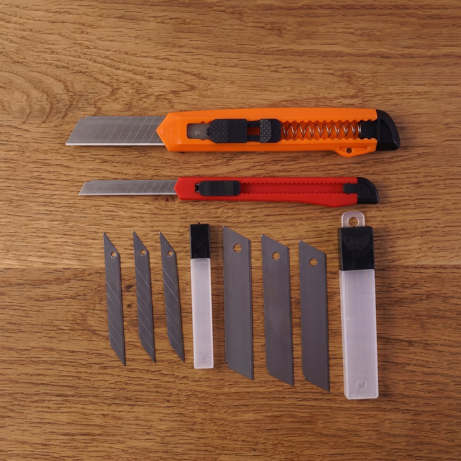 Detailed view of the utility knife with ergonomic handle and steel blade.