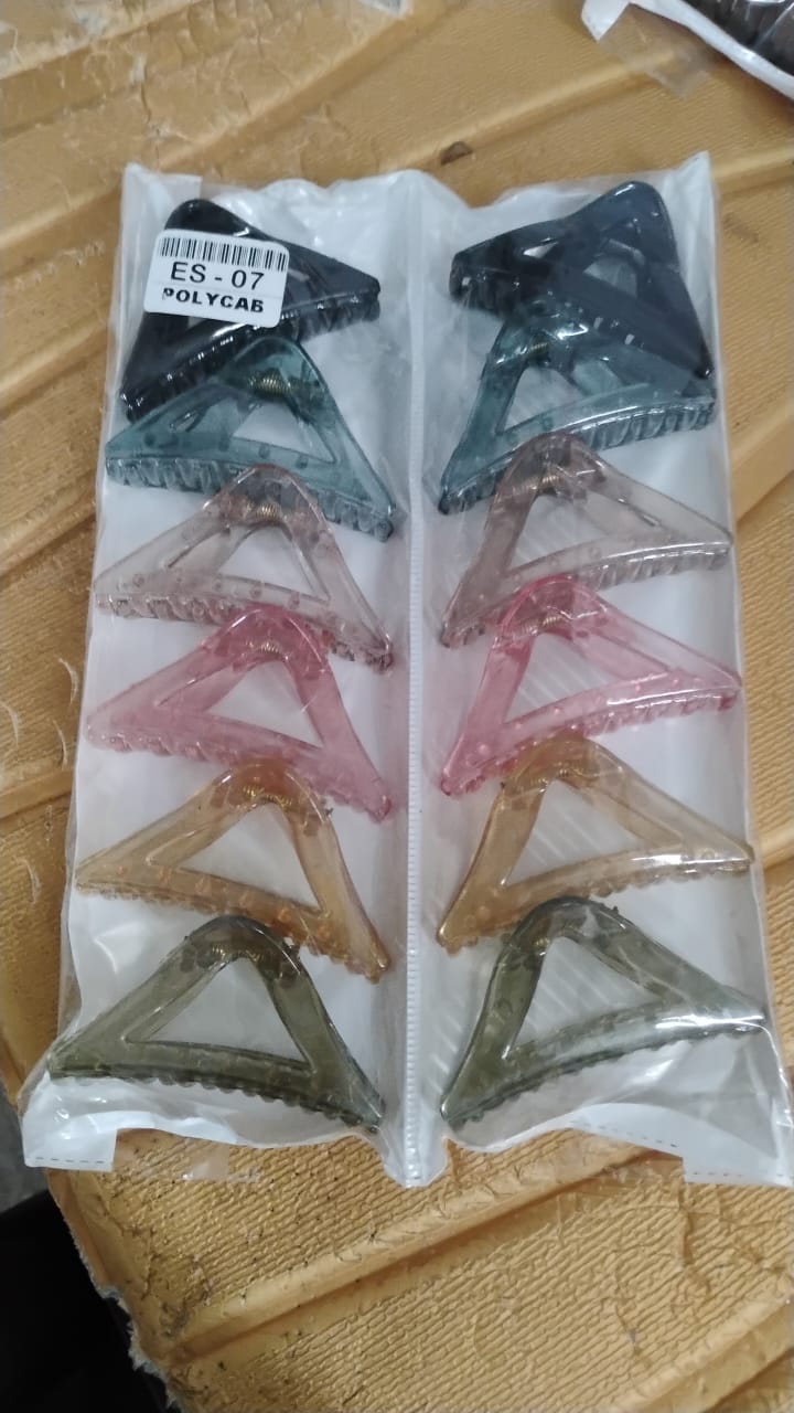 Triangle shaped colorful plastic hair claw clip styled in hair
