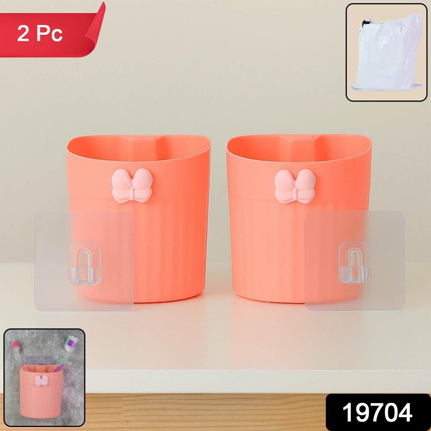 Set of two wall-mounted butterfly toothbrush holders in packaging