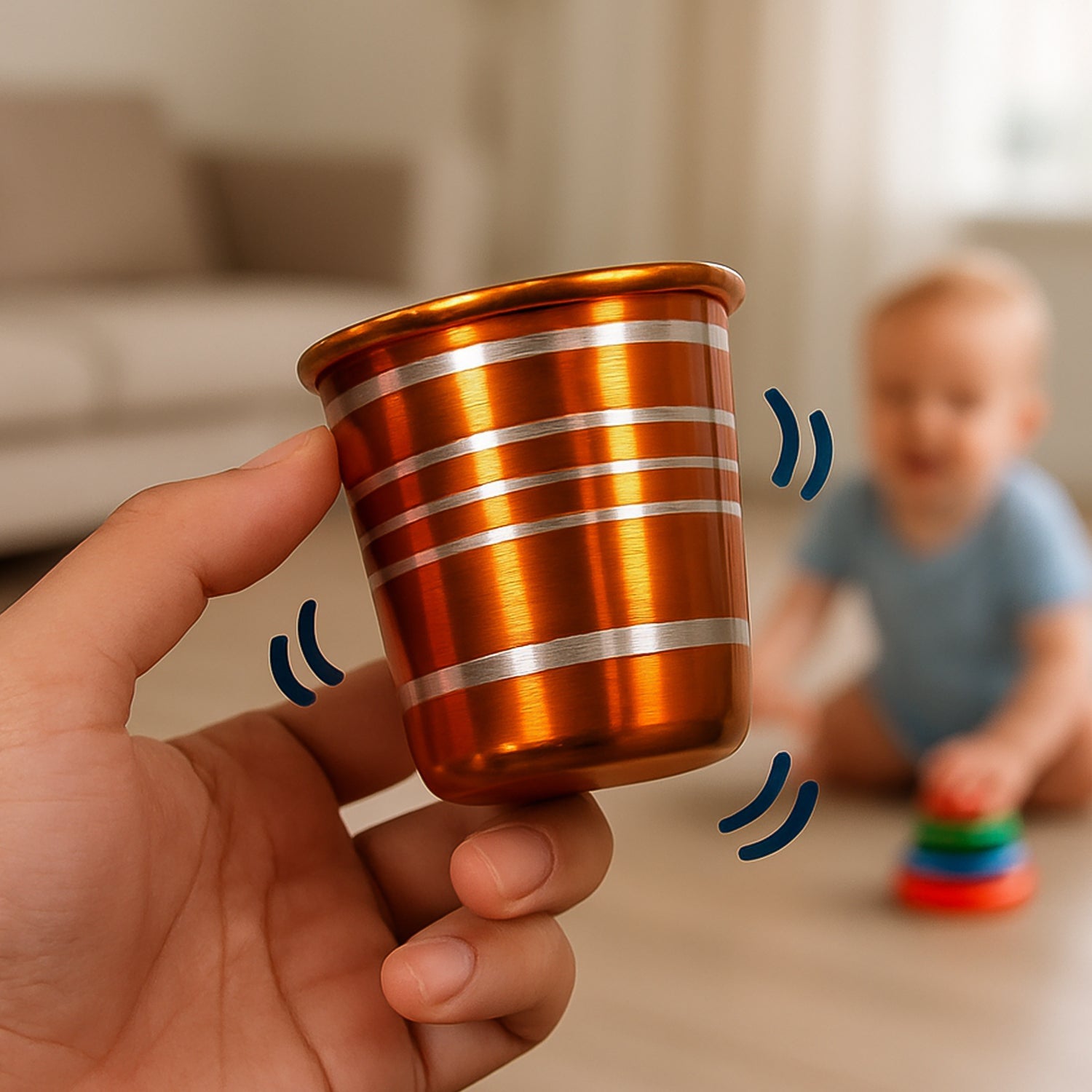 Close-up of a single stainless steel kids drinking glass with bell.