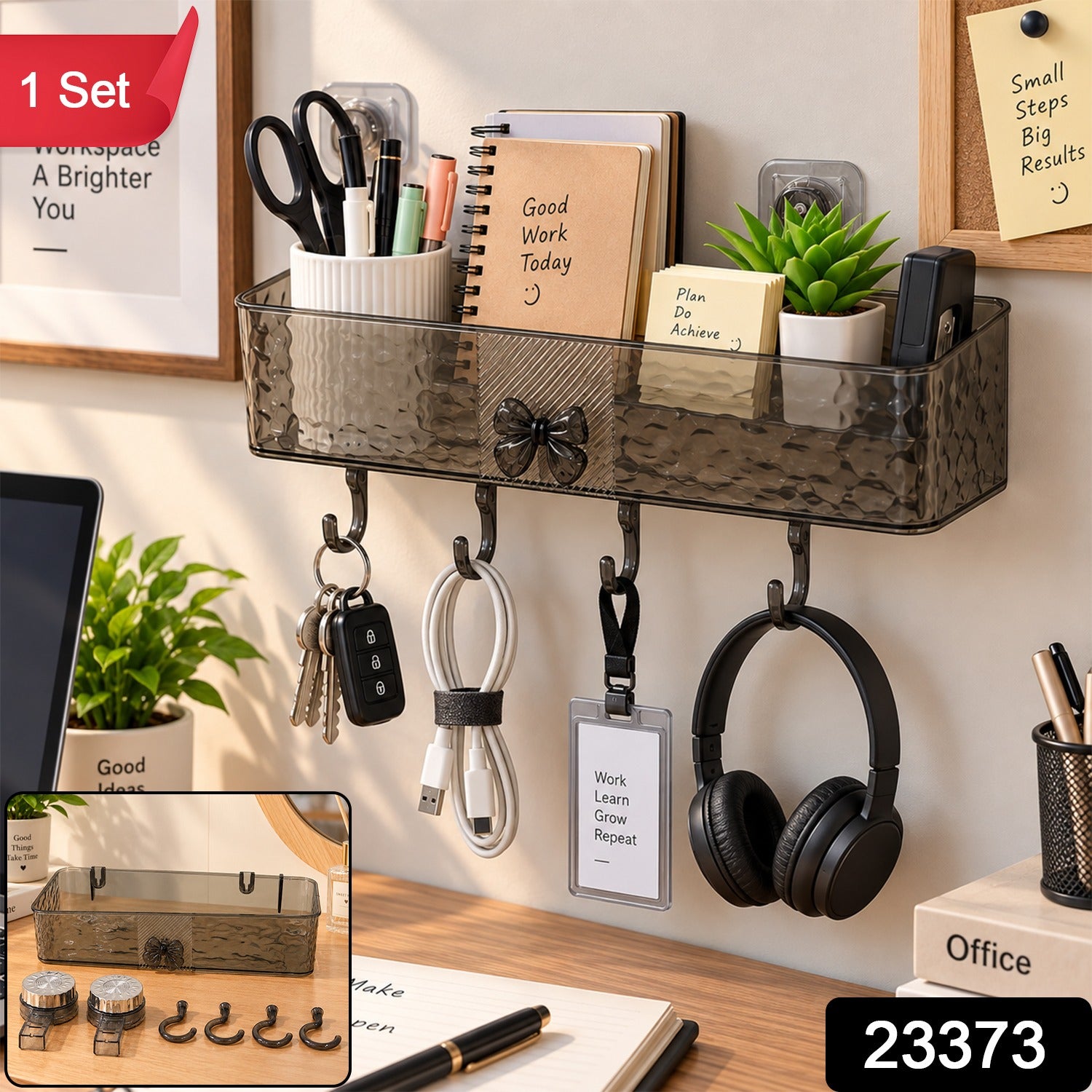 A dark gray plastic wall-mounted storage shelf with four hooks, holding office supplies, keys, and headphones, with a red "1