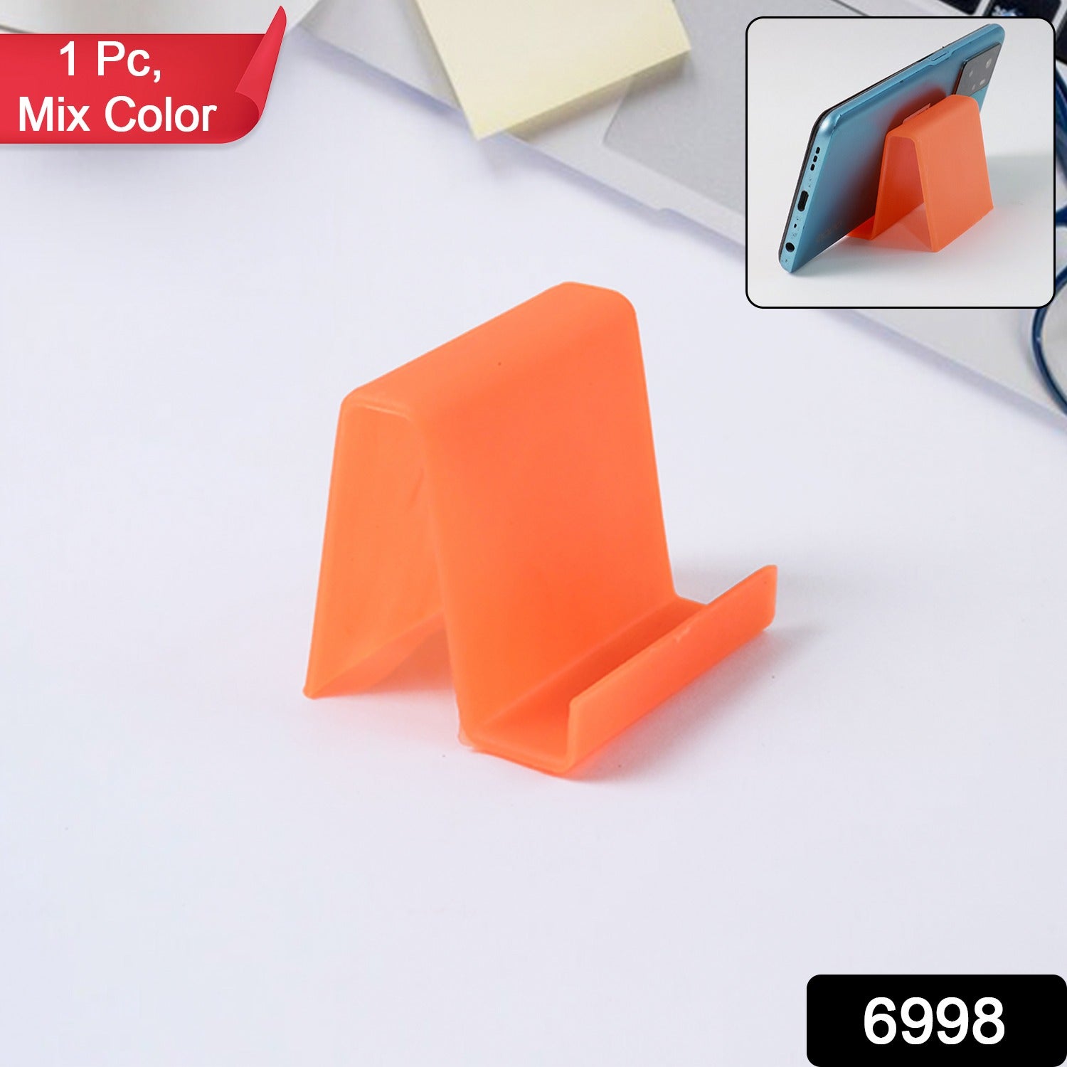 Plastic phone stand holding smartphone on desk