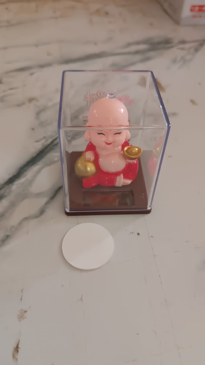 Solar powered moving head Buddha in natural light