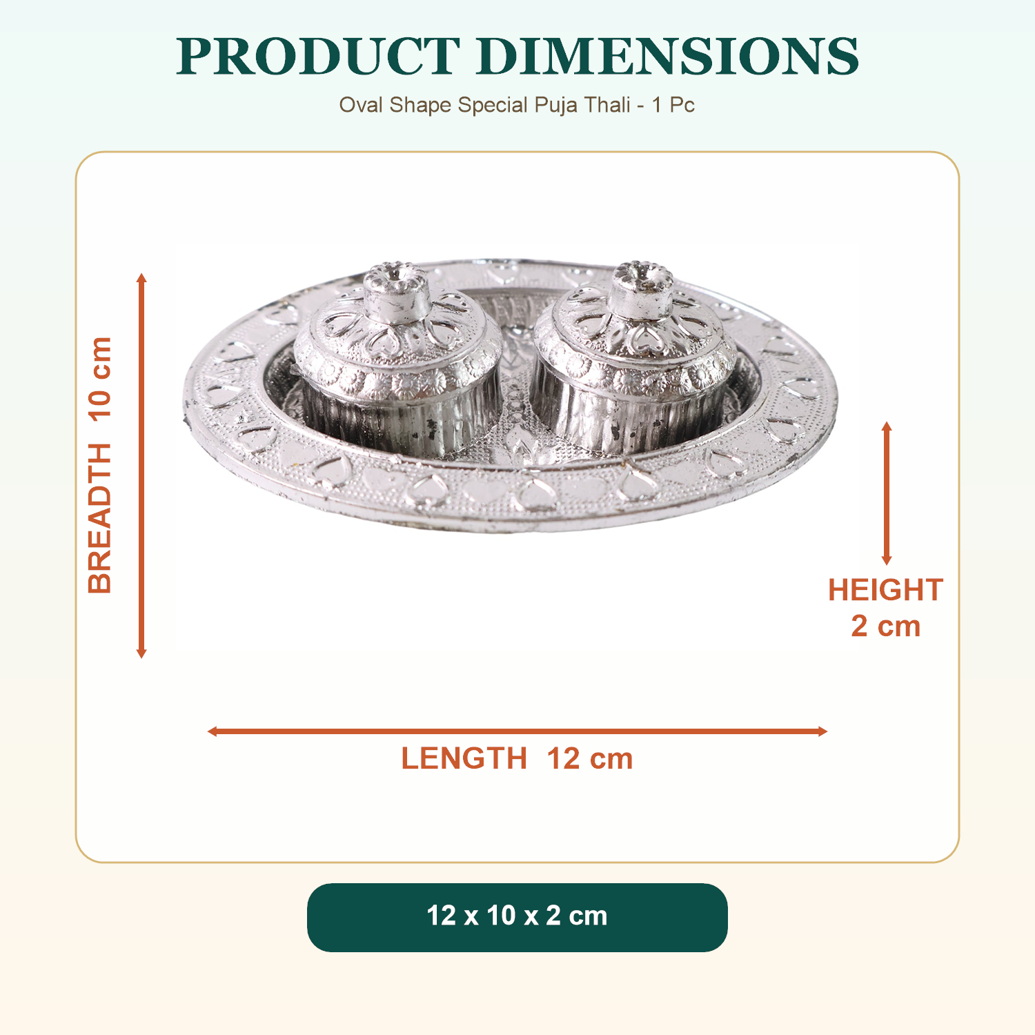A silver oval puja thali with two small lidded containers, displayed with its length, breadth, and height dimensions.