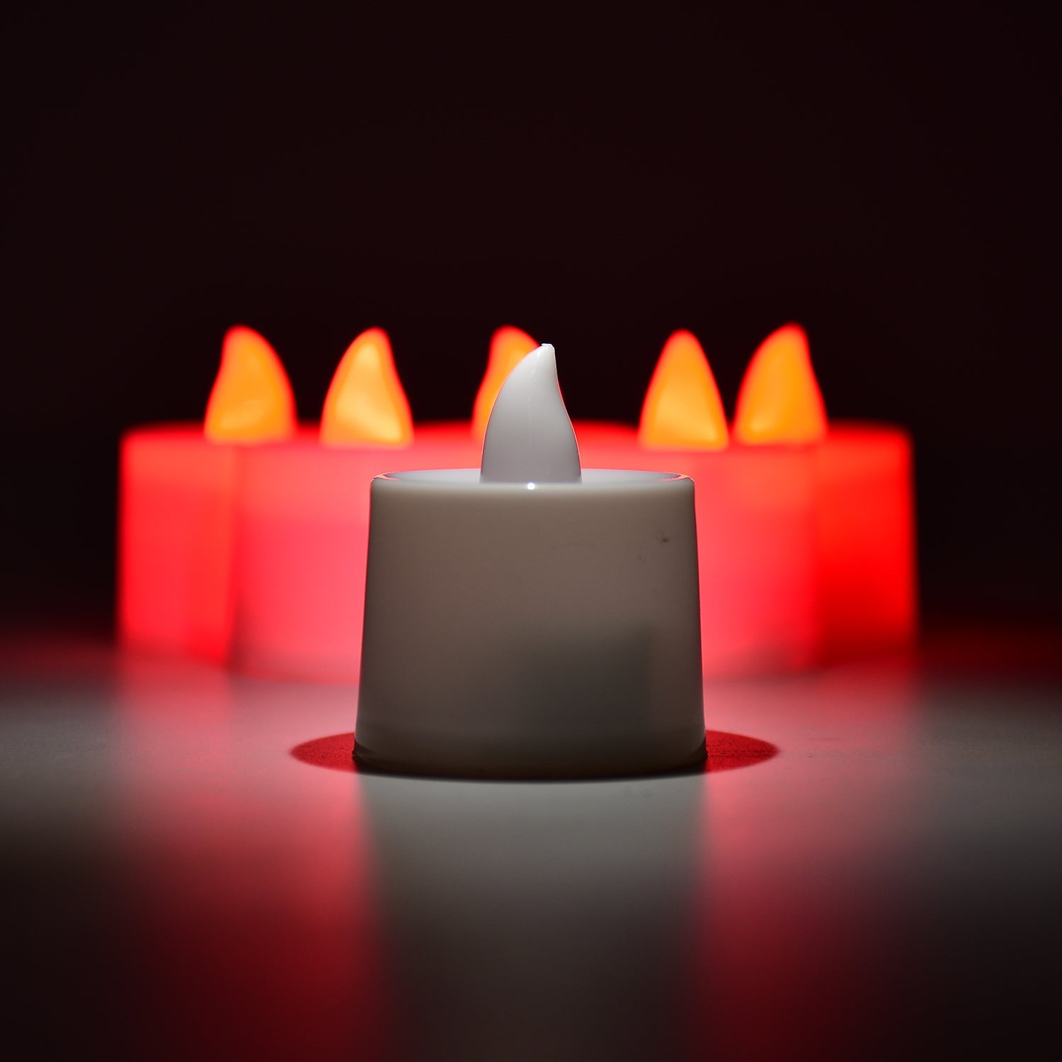 Red flameless tealight candles in decorative holders for ambient lighting