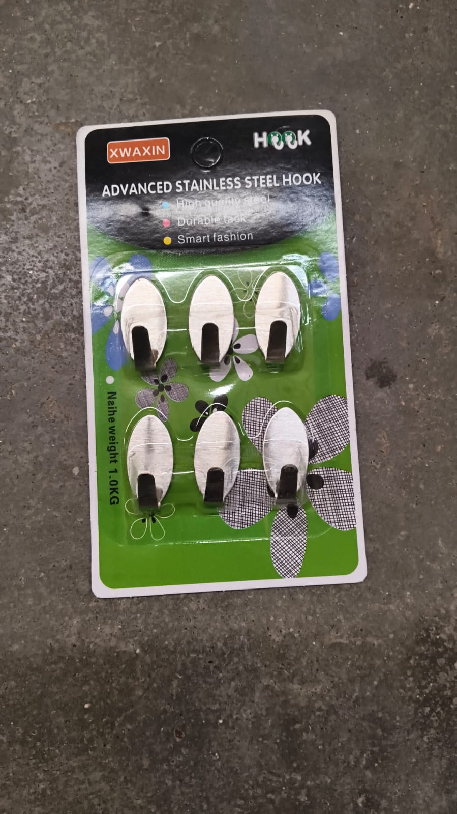 Close view of adhesive hooks on wall