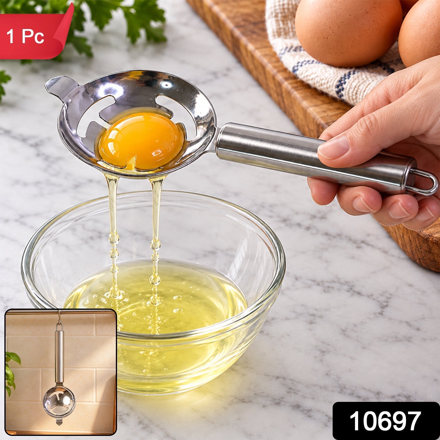 A hand holds a stainless steel egg separator with a yolk, draining white into a clear bowl, with an inset image.