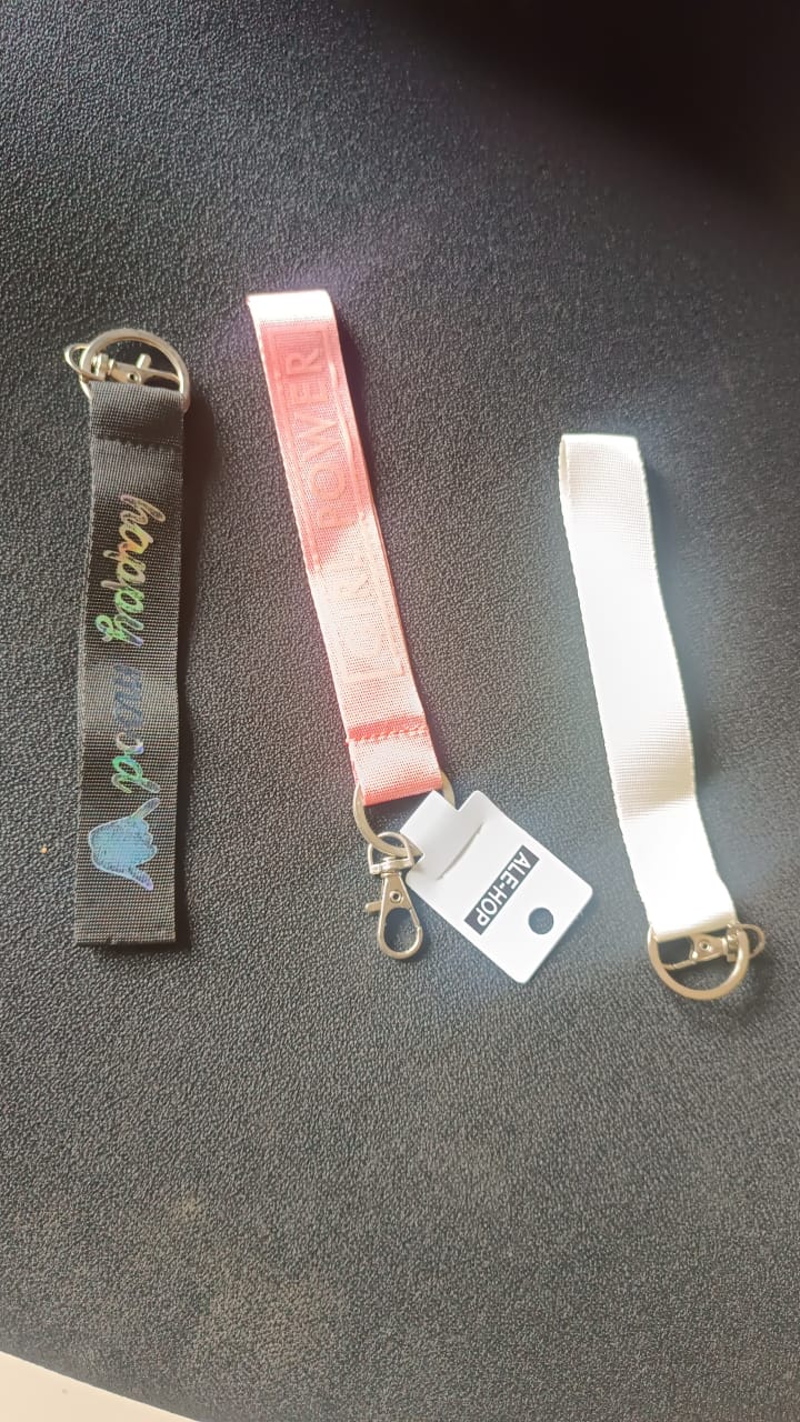 Girl Power Fabric Ribbon Keychain hanging on white background