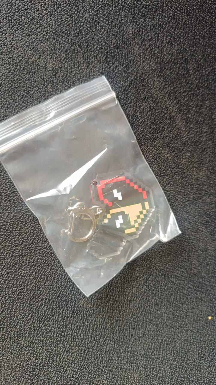 Pixel Style Acrylic Keychain on black background
