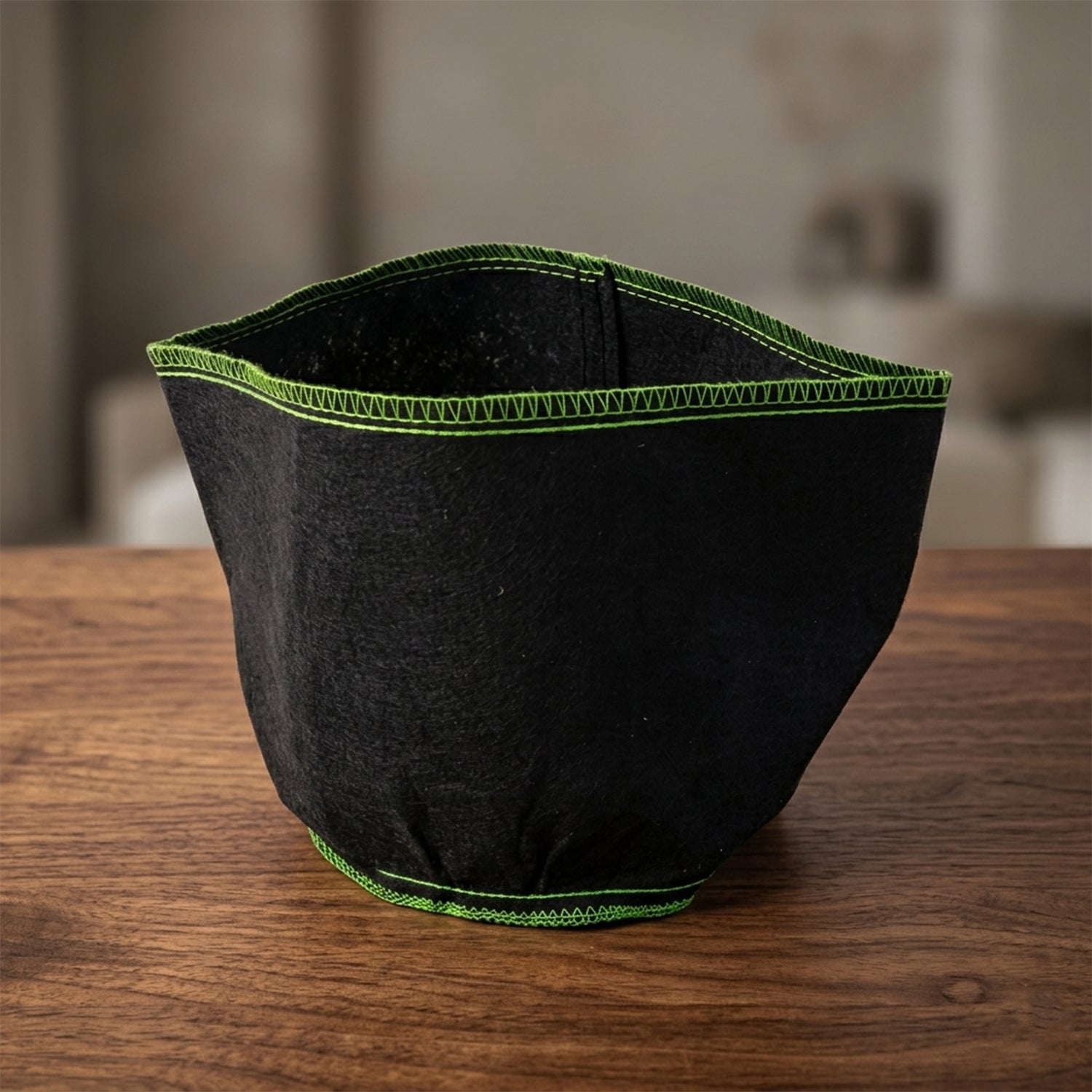 Compact foldable fabric storage box in green stitching