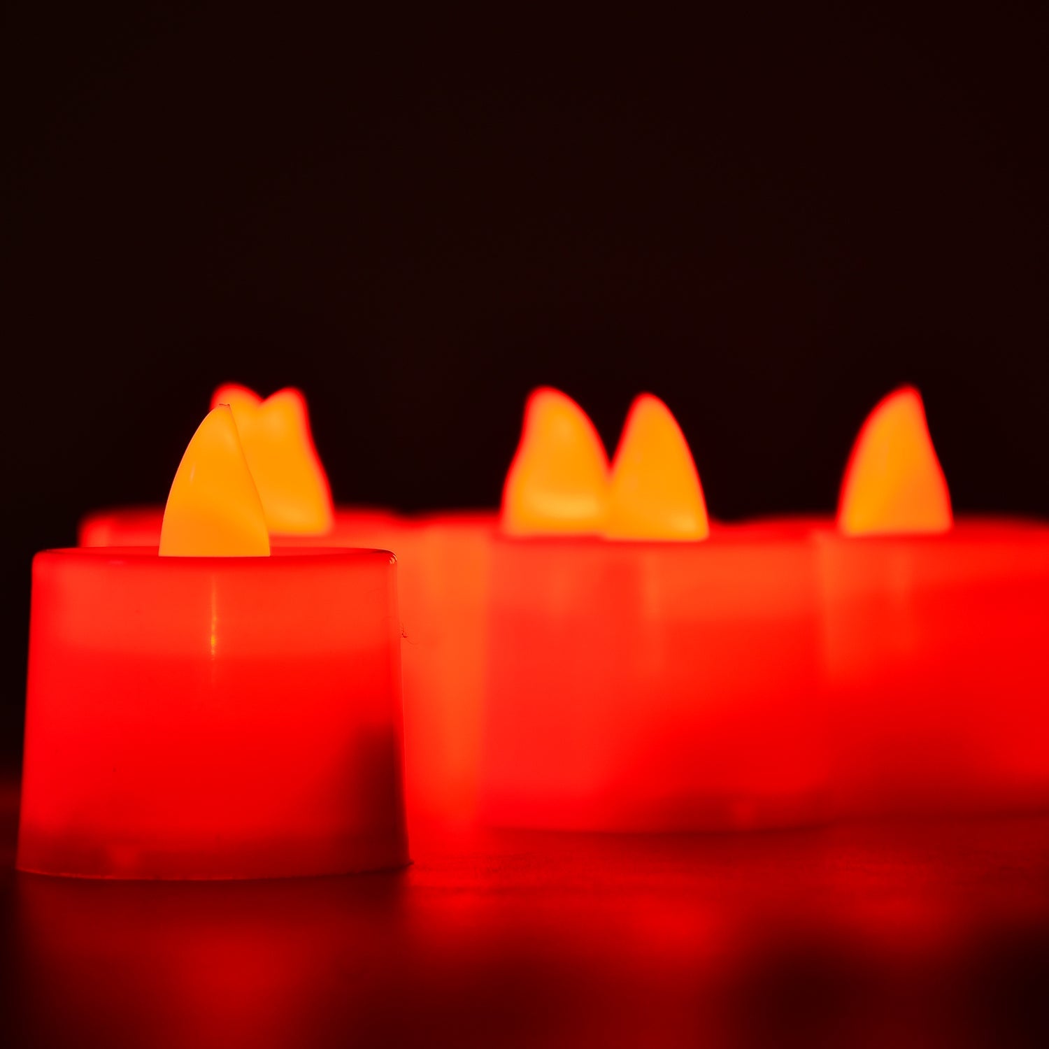 Red LED flameless tealight candle with on/off switch and battery compartment