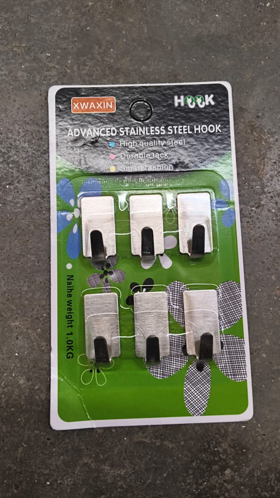 Adhesive wall hooks on mounted surface